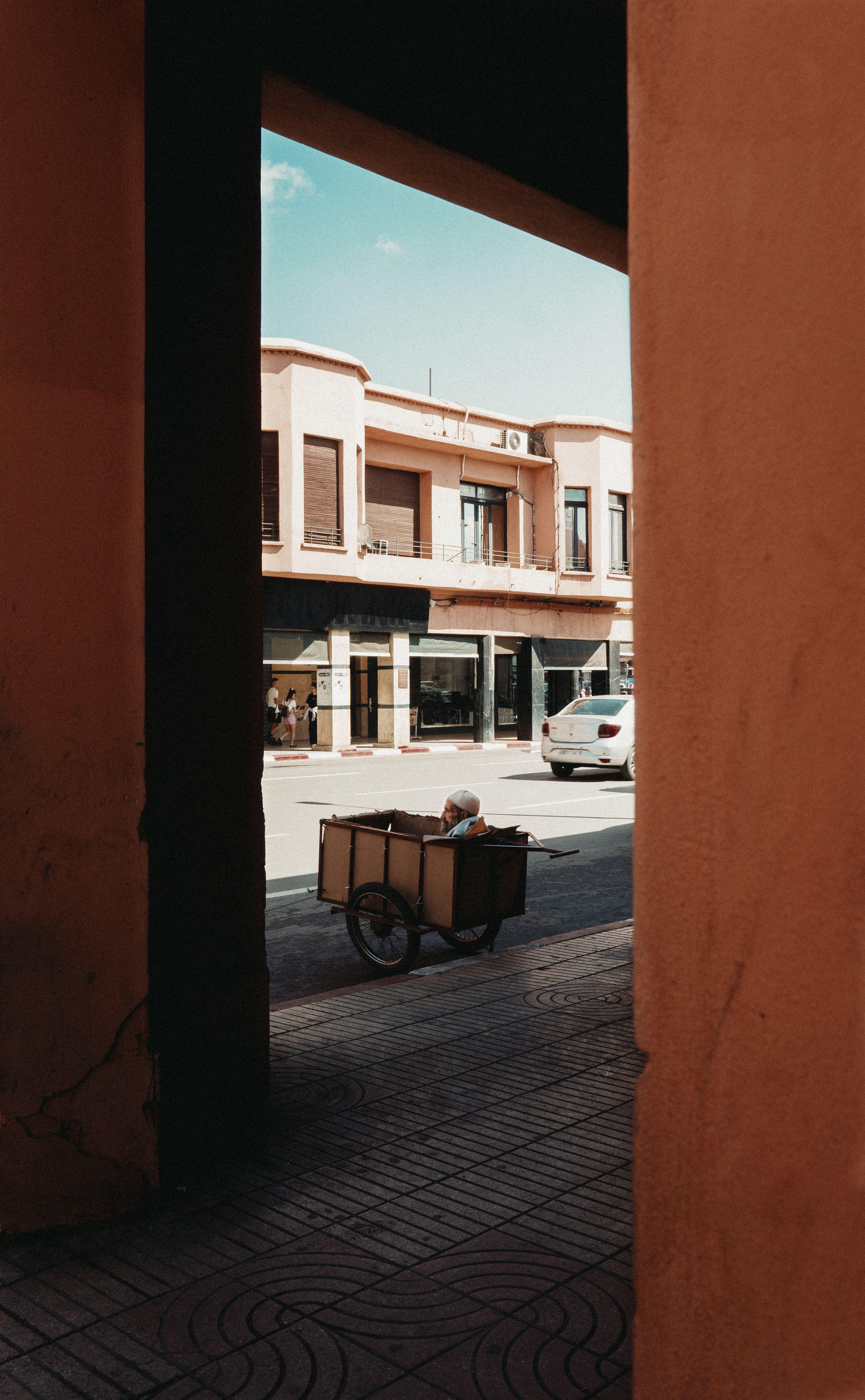 Cart moving through an archway in Marrakesh